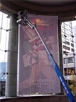 60&rsquo; indoor boom lift to install banner inside department store in Seattle, WA